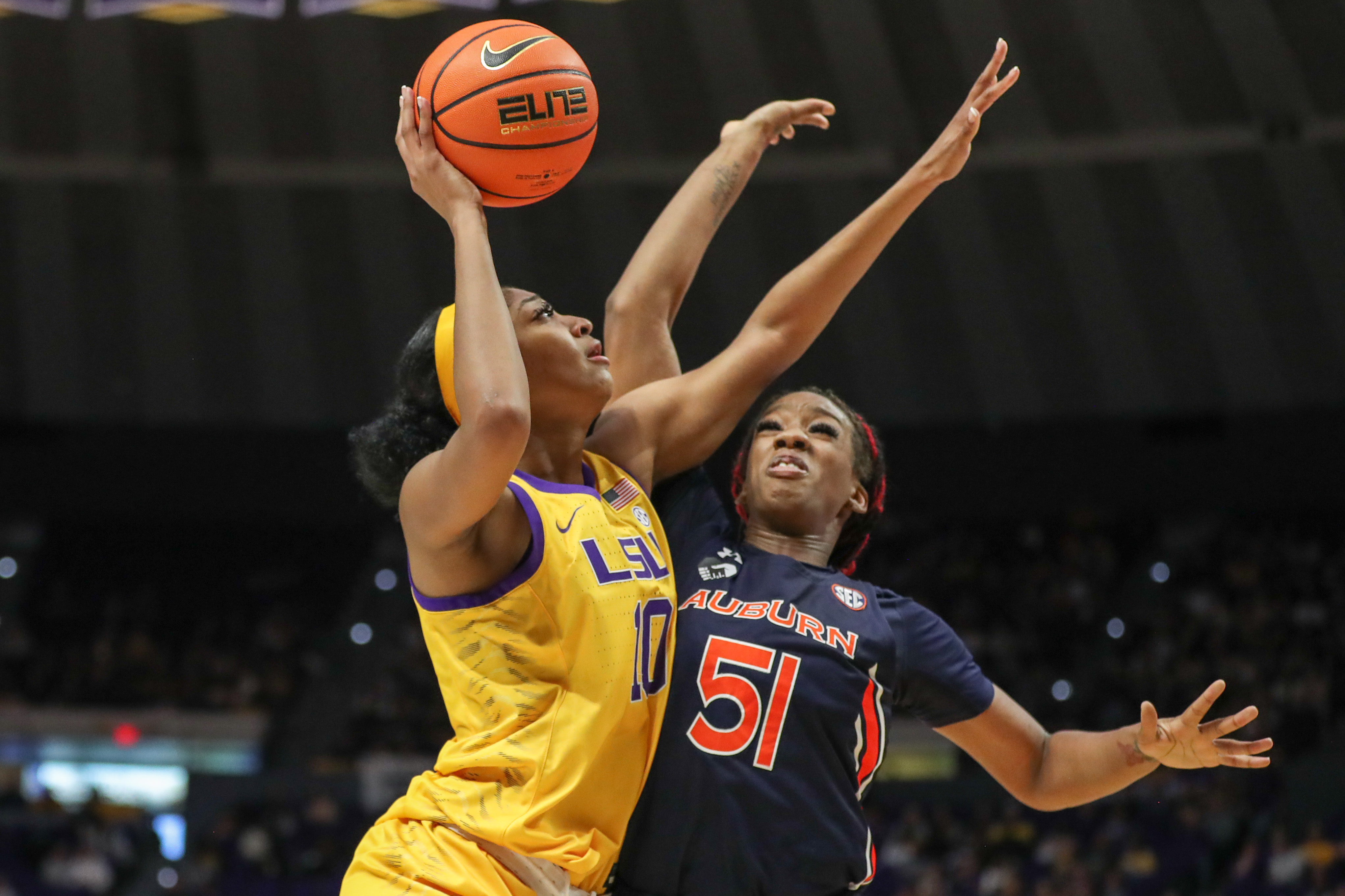 Angel Reese (10) drives on Auburn's Precious Johnson (51)