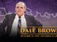 Tribute banner featuring Dale Brown in a suit, with his name and dates: Oct 31, 1935 – Oct 23, 2026.
