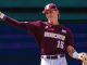 Baseball pitcher in a maroon Bobcats uniform throwing a ball, wearing a cap and glove.