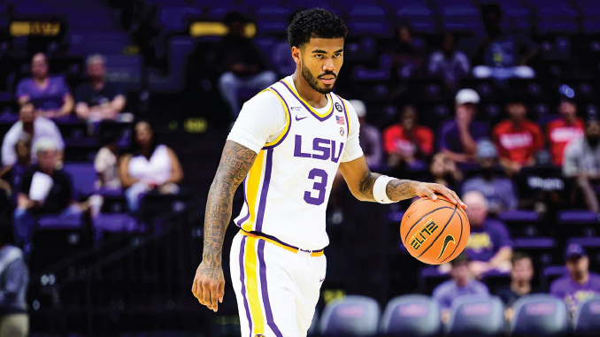 LSU basketball player wearing #3 in a white uniform dribbles the ball on court with purple seats in the background behind him.” (shortened)