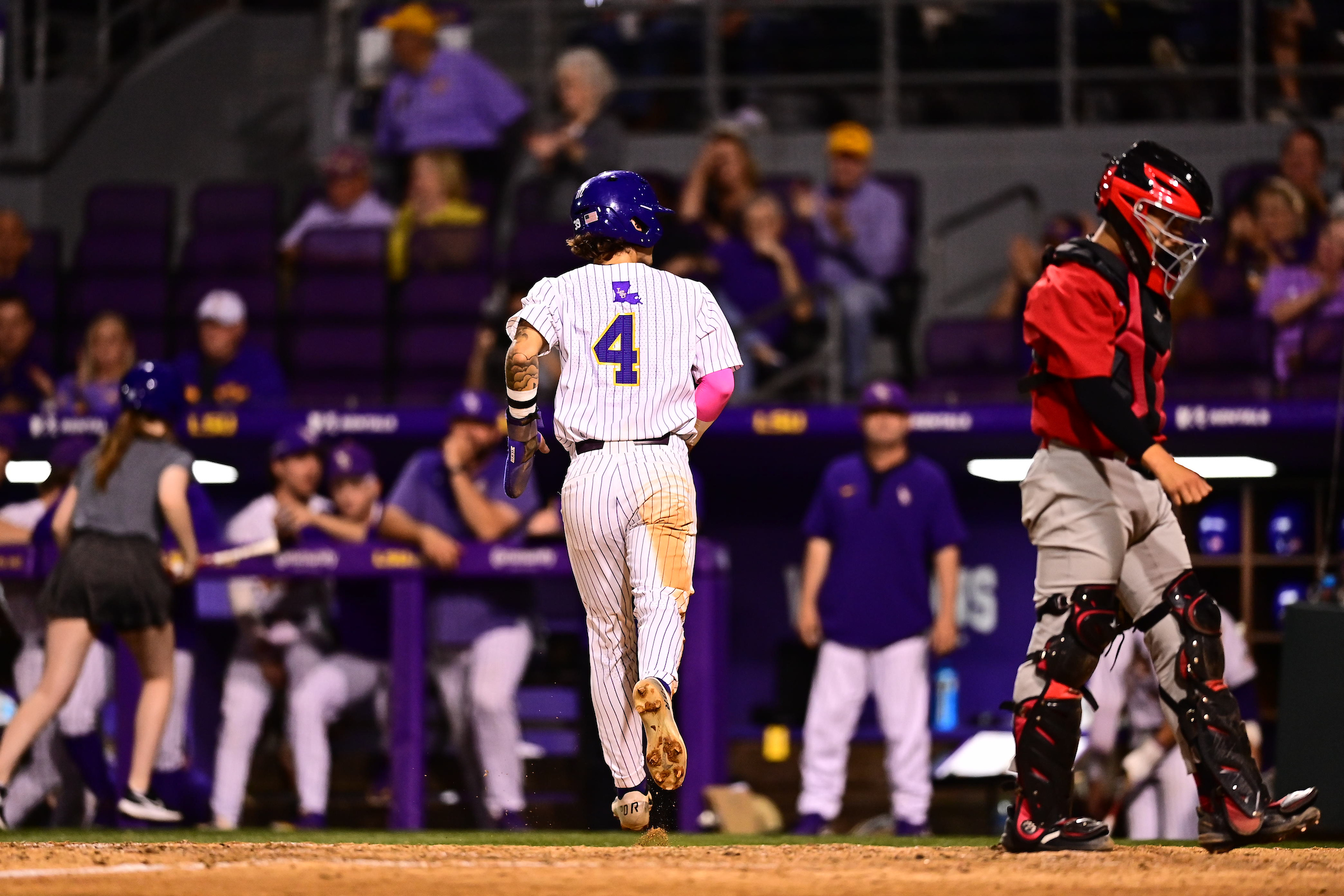 Jordan Thompson, LSU shortstop, scoring a run