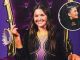 Smiling young girl sits on a purple throne in a sparkly outfit, with a tiara resting on the armrest. An inset shows a close-up portrait of her.