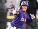 LSU Tigers baseball player in a purple uniform slides toward base with arms outstretched as an umpire watches the play.