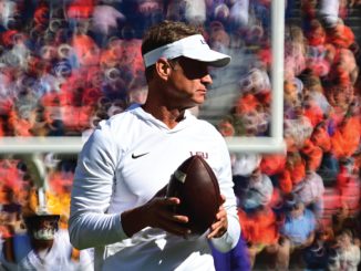 Lane Kiffin, LSU head coach, warming up at Auburn 2026