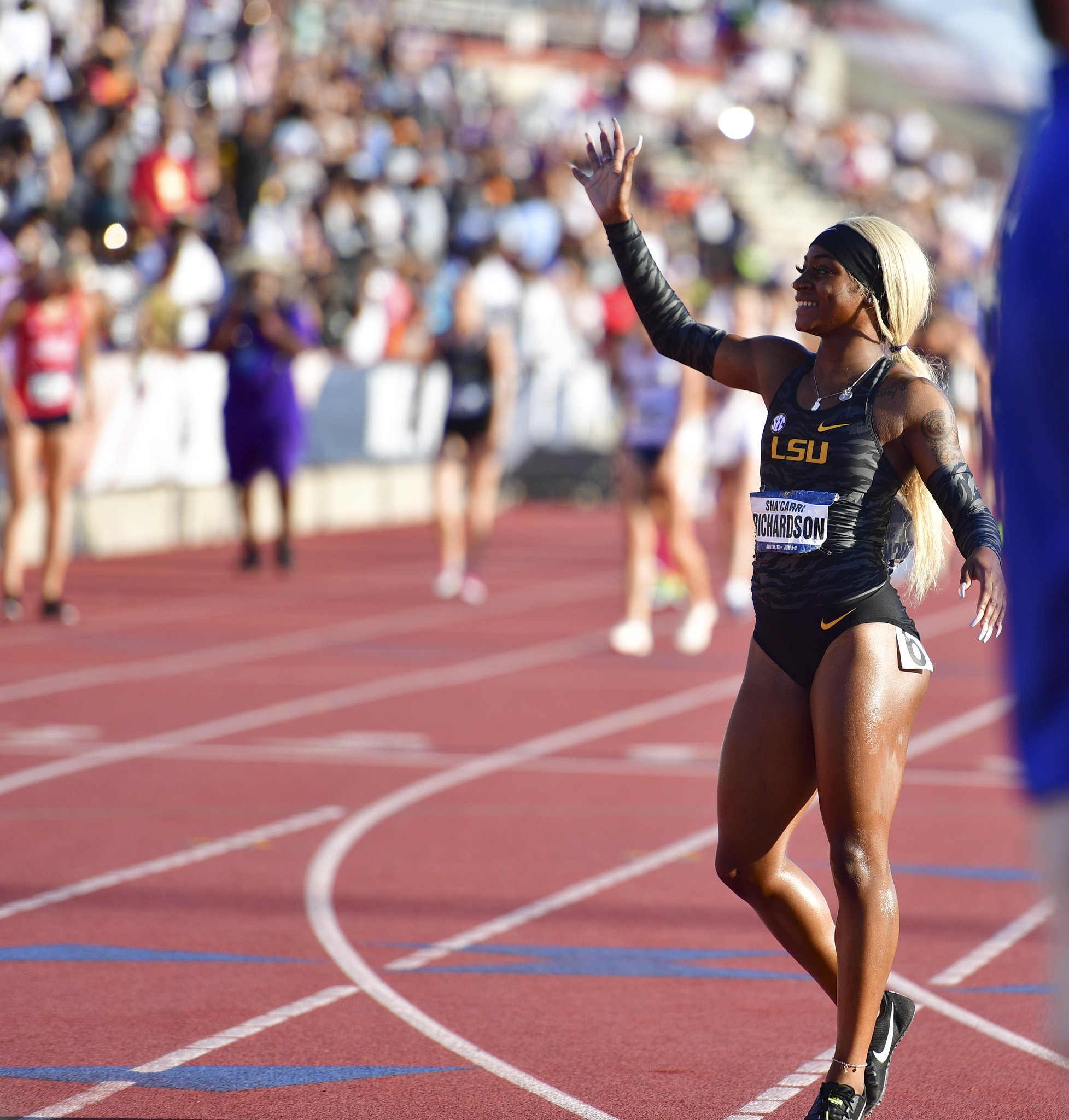 Sha'carri richardson celebrates winning the women's 100 meter fin...