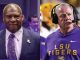 Two men side by side: left is a bald man in a navy suit and patterned tie; right is an LSU football coach in a purple hoodie with a headset.